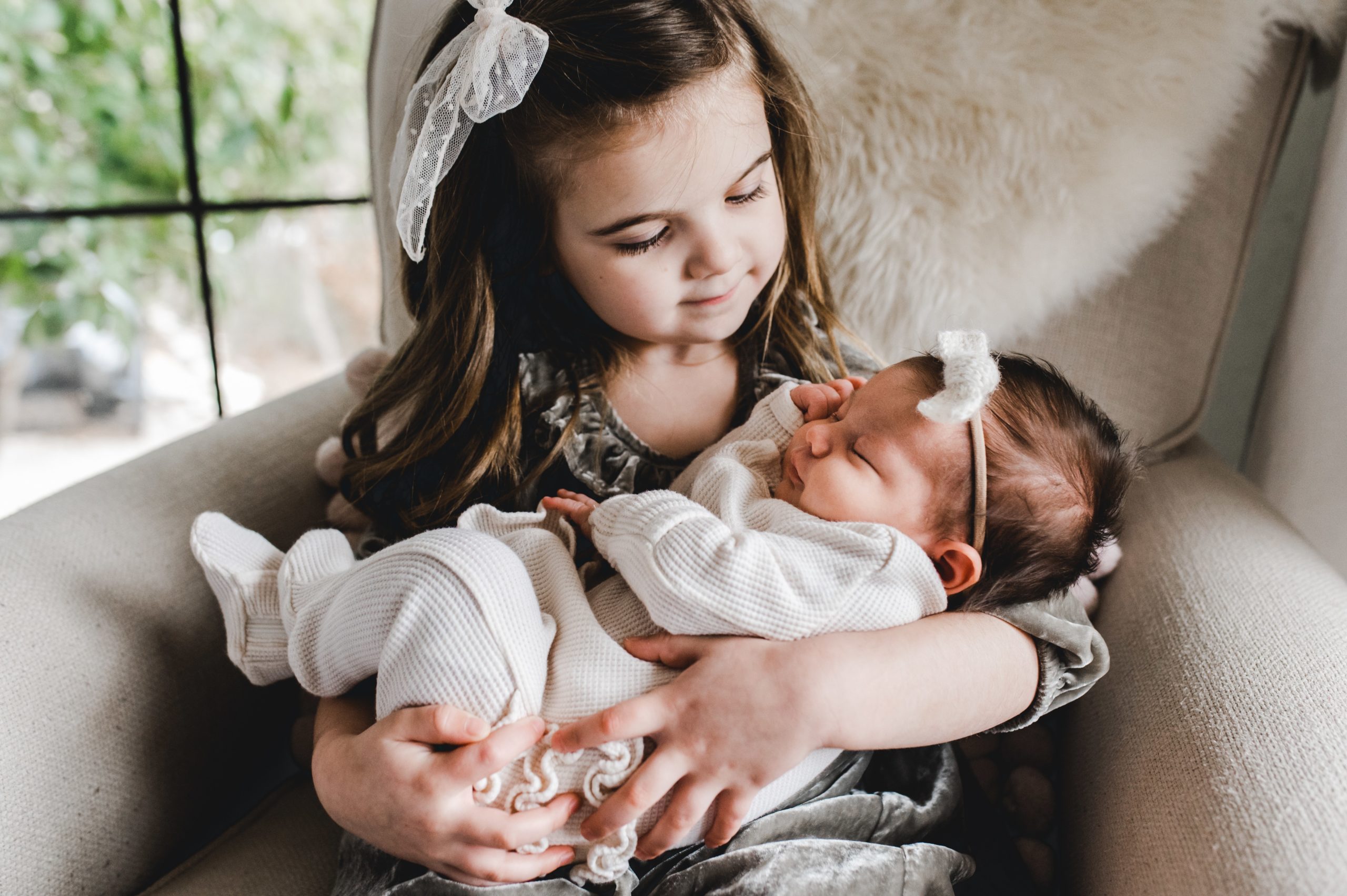 big sister with baby sister in-home newborn session